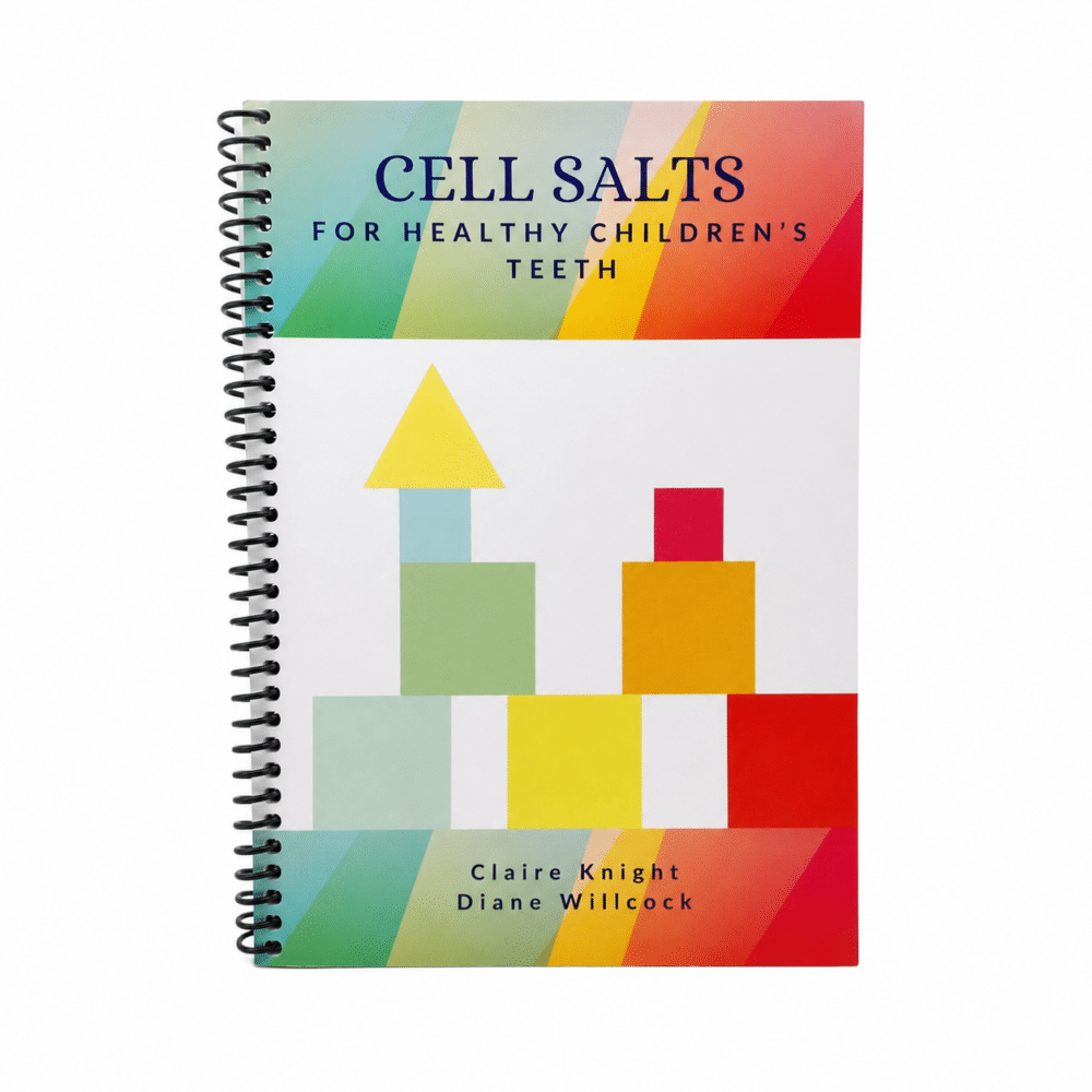 Cover of a spiral-bound notebook titled 'Cell Salts for Healthy Children's Teeth' by Claire Knight and Diane Willcock, with colorful geometric blocks on a white background.